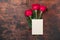 Valentine`s day blank card with red rose flowers on vintage wooden background. Valentines day mockup