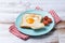 Valentine\\\'s Day breakfast with egg with tomatoes, heart shaped and toast bread