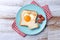 Valentine\\\'s Day breakfast with egg with tomatoes, heart shaped and toast bread on wooden table
