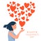 Valentine`s day card with happy lady. Cute girl in love blowing kiss in the shape of a heart.