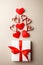 Valentine`s Day. Composition made of gift, origami hearts and ribbon on gray background. Valentines day background. Flat lay, top