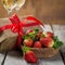 Valentine`s day concept - champagne, strawberry and present