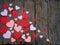 Valentine`s Day concept. Composition of paper colourful hearts on wooden background.