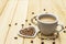 Valentine`s Day concept. Cup of coffee, knitted heart, string of pearl beads. Romantic breakfast and gift on wooden boards