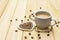 Valentine`s Day concept. Cup of coffee, knitted heart, string of pearl beads. Romantic breakfast and gift on wooden boards