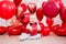 Valentine`s day concept - little baby girl with red balloons