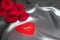 Valentine\'s day concept, Mother day concept, red roses on silk gray background with red hearts Love