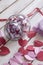 Valentine`s day concept. Opened Date Jar with desires and paper hearts on wood