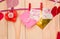 Valentine`s day concept. origami paper hearts and envelopes on a hanger on wooden background