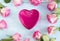 Valentine`s day concept with purple box shape heart with pink roses on the blue paint wooden background