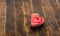 Valentine\\\'s day concept. Red heart on a wooden background. A symbol of love  happiness and devotion. View from above