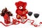 Valentine`s Day concept. Red teddy bear with red wine and heart shaped candle with red ribbon and red roses on isolated white back