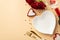 Valentine`s Day concept. Top view photo of heart shaped dish candles knife fork wine bottle wineglass bouquet of red roses and