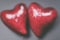 Valentine`s day concept, two red blurred hearts close up