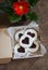 Valentine`s day cookies-hearts with jam in the box and gerbera flower on wooden table