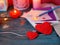 Valentine`s Day decor on a wooden textural table, a pair of large red felt hearts