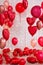 Valentine`s day decoration - group of red circle and heart shaped balloons