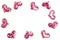 Valentine's day decorative border. Many pink sequin hearts on white