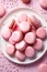 Valentine\\\'s Day dessert idea, delicious pink macarons on a platter, sweet romantic gift