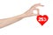 Valentine\'s Day discounts topic: Hand holding a card in the form of a red heart with a discount of 25% on an isolated
