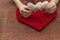 Valentine`s Day, February 14th. Red and white hearts. Fire candles. Red manicure. Frame. Background. Light, brilliant. Hearts mad