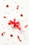 Valentine`s Day gift box on a white background with confetti and party streamers. Minimalist style