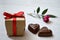 Valentine\'s Day gift, chocolate hearts and a rose