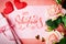 Valentine`s day. Greeting card on coral background. Selective focus. Horizontal.