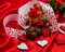 Valentine`s day greeting card in red with cakes. flowers