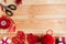 Valentine`s Day Handmade Red Thread Hearts and needlework supplies on wooden background.