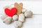 Valentine\'s day hearts on rocks and wood background.