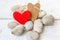 Valentine\'s day hearts on rocks and wood background.