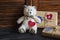 Valentine\'s day homemade gifts in craft paper with hearts tags, toy bear