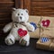 Valentine\'s day homemade gifts in craft paper with hearts tags, Toy bear