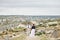 Valentine`s day loving couple in nature hugs and kisses, man and woman love each other. Mountains of Cappadocia in Turkey