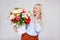 Valentine`s day or mother`s day concept - portrait of surprised beautiful and elegant plus size blonde woman holding box with