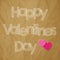 Valentine`s Day postcard white scribble Letters with Hearts on a crumpled paper brown background.