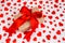 Valentine`s Day. Presented as a red ribbon on a white paper with red hearts