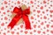 Valentine`s Day. Presented as a red ribbon on a white paper with red hearts