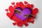 Valentine`s Day Promotion Name Roach - QUIT BUGGING ME. Cockroaches on purple background, view through cut out heart from paper