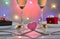 Valentine's Day or romantic birthday dinner with candy hearts, glasses of champagne and elegant table setting with reflection