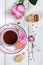 Valentine\'s Day: Romantic tea drinking with macaroon and hearts