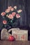 Valentine\\\'s day still lifewith wooden calendar, pink roses and hearts on dark