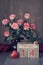 Valentine\\\'s day still lifewith wooden calendar, pink roses and hearts on dark