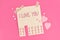 Valentine`s day tear off stub note with text `I love you` and reply `I love you too` on pink background