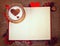 Valentine`s postcard. Cup of coffee on open book with wooden hea