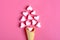 Valentine`s postcard - marshmallows in the shape of a heart and ice cream cone on a pink background