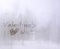 Valentine`s winter letters with mini heart by hand writing on frosted glass and blurry winter background