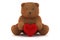 Valentine teddy bear holding a heart isolated