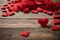 Valentine week Background of a red felt hearts of various sizes scattered on a weathered wooden surface.